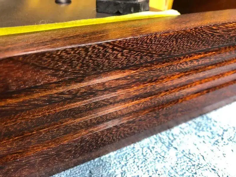 A closeup shot of the classic Afromosia fluted LP12 plinth.